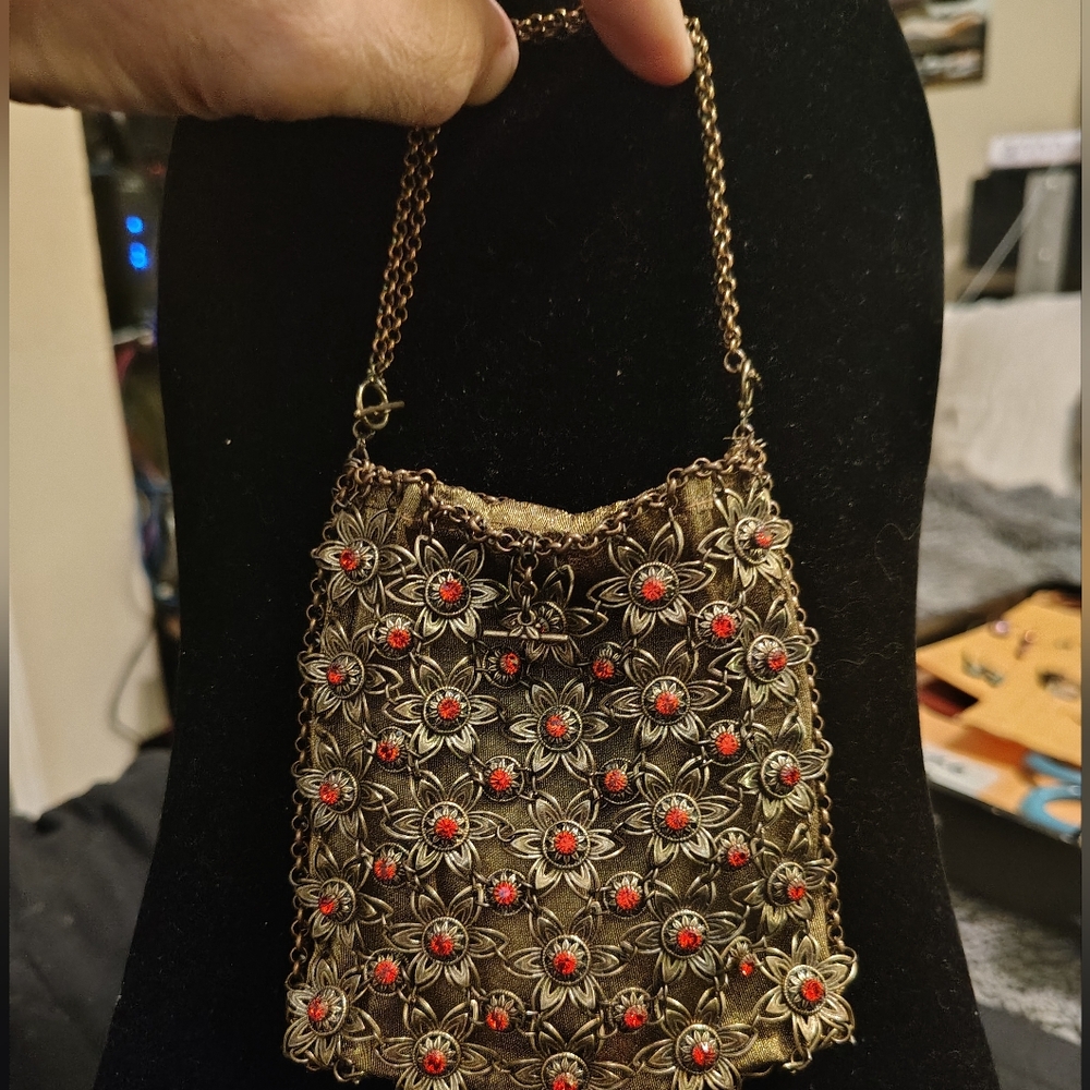 Elegant floral embellished gold and red stone Women's Bag designed by Kenny Ma